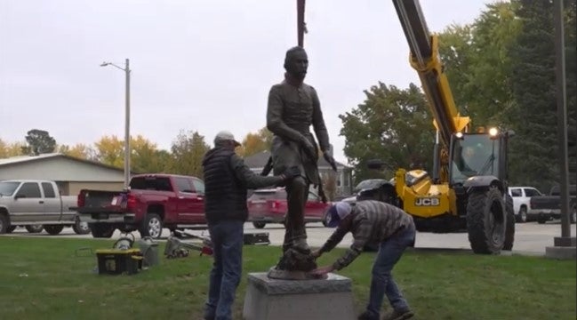 The installation of the statue. Photo captured by author from News Channel Nebraska.