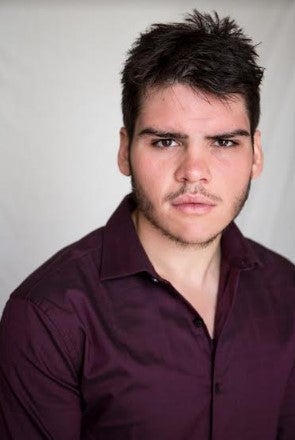 Robert (student) faces the camera, the background is plain white.