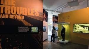 museum gallery picture with single person standing and text that reads "The Troubles and Beyond"