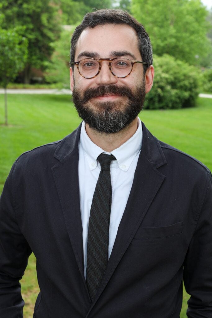 Speaker, with James Joyce glasses and beard